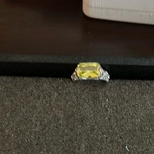 Silver tone ring with light green stone.